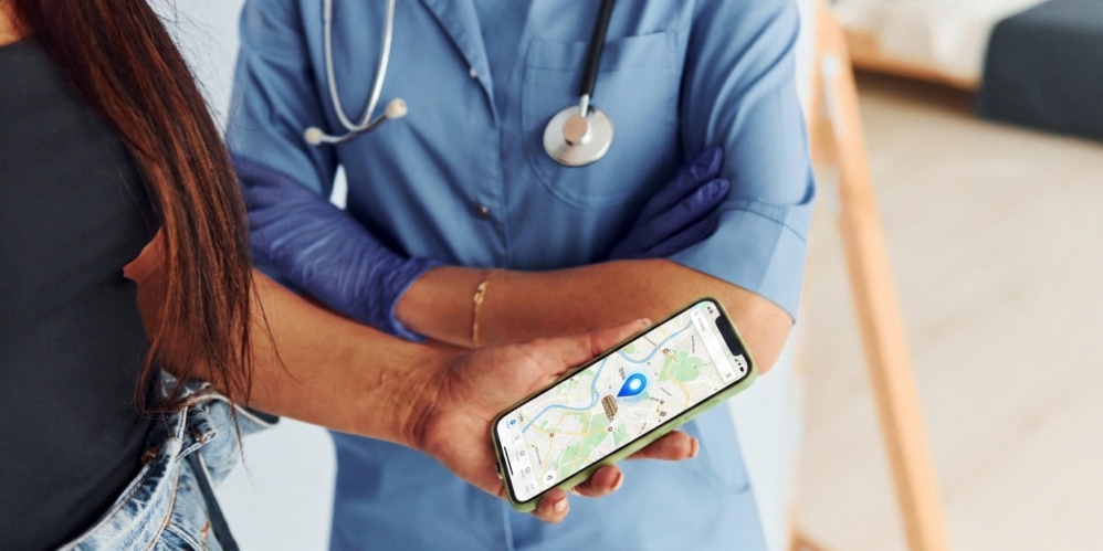 A patient using a hospital wayfinding app on a smartphone